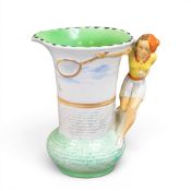 Burleigh Ware Tennis player jug, the handle in the form of a tennis player in an orange hat. (H: