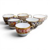 A collection of 19th century porcelain tea cups in various patterns from different manufacturers,