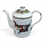 Hermés Cheval d'Orient porcelain tea pot, featuring decorative horses and gold detailing.
