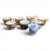 A collection of 19th century porcelain tea cups in various patterns from different manufacturers,