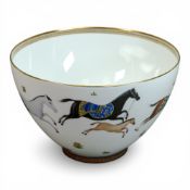 Hermés Cheval d'Orient porcelain footed punch bowl, featuring decorative horses and gold