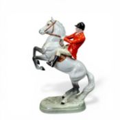Beswick model of a Huntsman on rearing grey gloss horse, model 868, h.24.5cm.