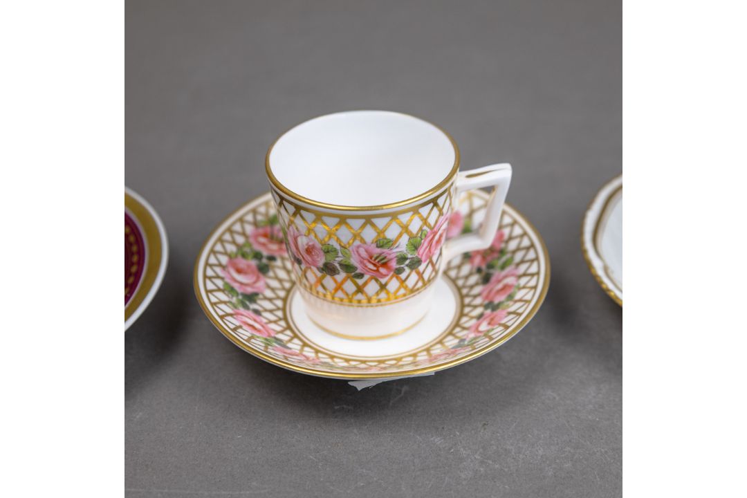 A group of five cups & saucers from various manufacturers, to include a Derby cup & saucer decorated - Image 4 of 7