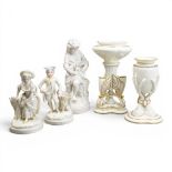 A group of ceramic pieces to include a pair of figures, boy & girl, both plainly decorated but