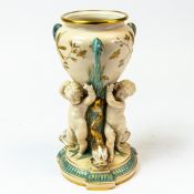 19th century Copeland porcelain vase, the three handled urn held up by three cherubs & dolphins,