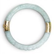 14ct gold mounted carved jade (or similar gemstone) heavy bangle.