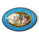 A large oval dish ornately decorated in the manner of Sevres porcelain, featuring a male and three