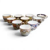 A collection of 19th century porcelain tea cups in various patterns from different manufacturers