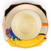 A Clarice Cliff trio in the Woodland pattern (cup, saucer & tea plate), approx diameter of tea plate