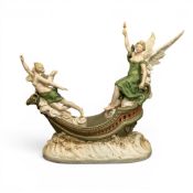 A large Royal Dux table centrepiece of two female figures in a boat, 47cm x 51cm. COURIER OR