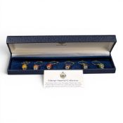 A set of 6 Faberge enamel egg & crystal wine glass charms in various colours. Each charm