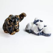 Royal Copenhagen Stoneware Bear Cub No:21433 together with a porcelain pair of Lambs No: 2769.
