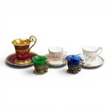 A group of five cups & saucers from various manufacturers, to include a Derby cup & saucer decorated