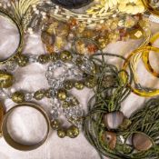 A good collection of vintage costume jewellery including coral, crystal, agate, bangles,