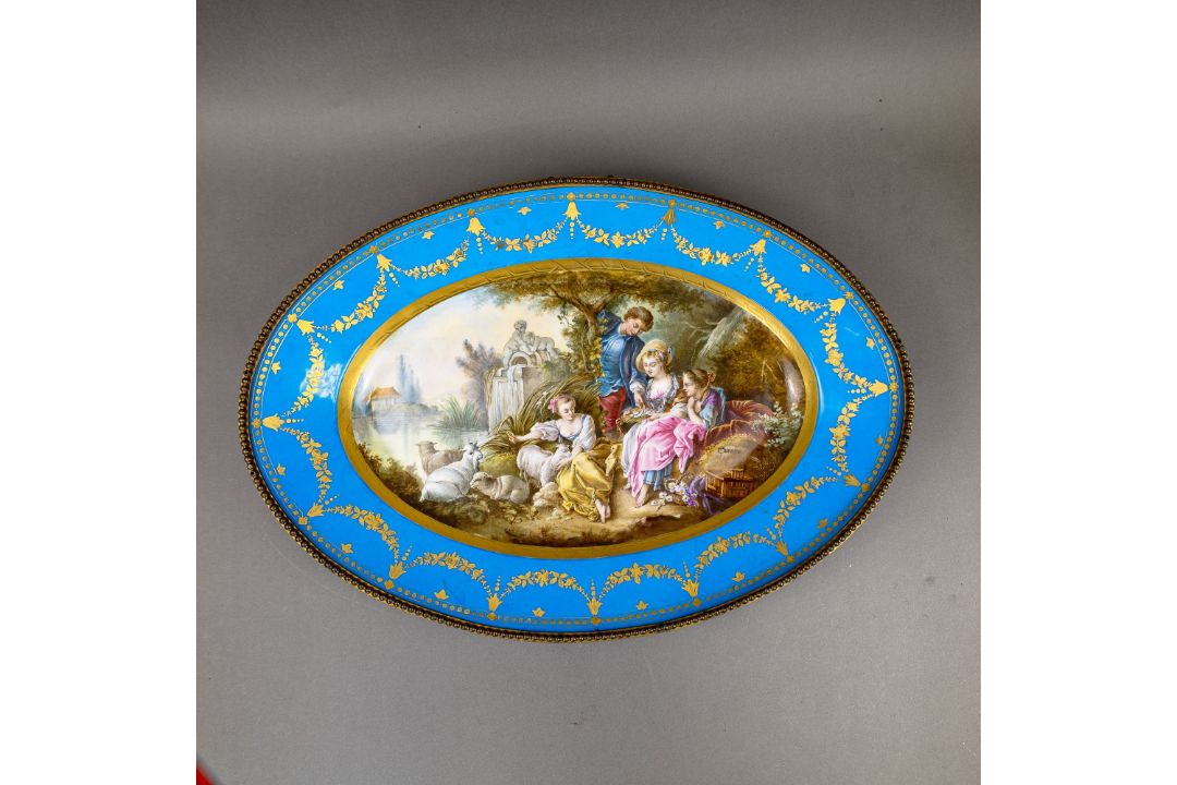 A large oval dish ornately decorated in the manner of Sevres porcelain, featuring a male and three - Image 2 of 9