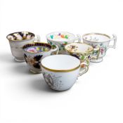 A collection of 19th century porcelain tea cups in various patterns from different manufacturers,