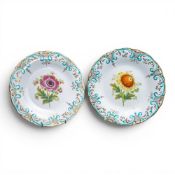 Two porcelain plates, both decorated with a floral design and ornately gilded, approx. diameter