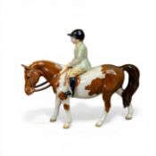 Beswick model of a boy with light green jacket on rare Skewbald pony, model 1500, h.14cm.