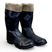 A pair of vintage military turned down rubber flying boots, with No.2 FLT/Shed No.5 written on the