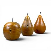 A collection of antique style fruitwood pear shaped tea caddies, tallest 21cm. (3)