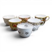 A collection of 19th century porcelain tea cups in various patterns from different manufacturers,
