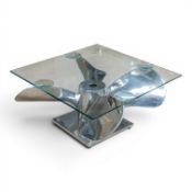 Chrome effect propellor coffee table with toughened glass top, 60 x 60cm.