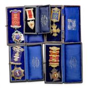 4 x hallmarked silver & enamel jewels associated with the ROAB, together with a base metal example.