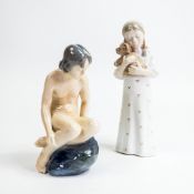 Royal Copenhagen Porcelain figures to include:- Nude lady on a Rock No:4027 designed by Ada