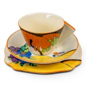 A Clarice Cliff trio, (cup, saucer & tea plate) in the Woodland pattern, tea plate appro diameter
