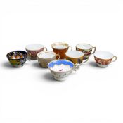 A collection of 19th century porcelain tea cups in various patterns from different manufacturers,