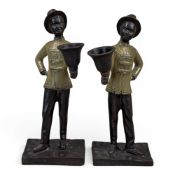 Pair of cast metalware candleholders, modelled as figures of African bell boys, h.19cm. (2)