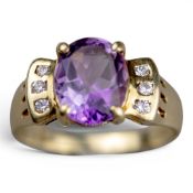 14ct gold amethyst & diamond ring, the central oval amethyst stone with each shoulder set with three