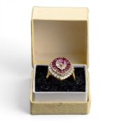18ct diamond & ruby interlocking ring/pendant, the oval shaped setting with central oval ruby