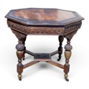 Edwardian carved oak octagonal shaped side table on carved turned supports, d.91 x h.78cm.