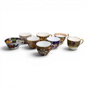 A collection of 19th century porcelain tea cups in various patterns from different manufacturers,