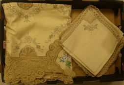 Vintage beige cotton table cloth featuring intricate handmade floral embroidery and delicate crochet