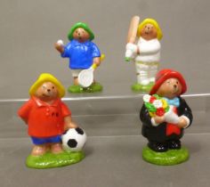 Four boxed Coalport Characters 'Paddington Bear' figurines, Penalty Kick, Oops, First Century and