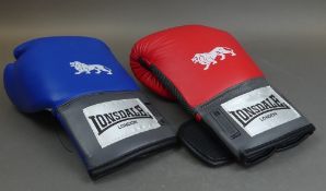 A pair of Lonsdale 14oz training gloves, left hand red and blue right hand. (2)