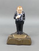 A painted plaster model of Winston Churchill on an Ash Tray plinth, height 20cm