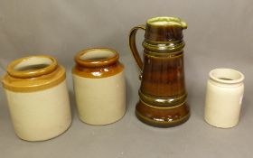 A West German large jug in an olive glaze, together with 3 stoneware storage jars, height of tallest