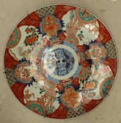 A Japanese large circular charger, decorated in the Imari palette, 46cm diameter, Meiji period.