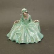 Early Royal Doulton figure Polly Peachum HN489, in a green colourway, impressed date for 1922.