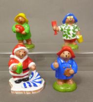 Four boxed Coalport Characters 'Paddington Bear' figurines, Father Christmas, The Artist, Beach Bear
