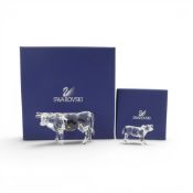 Swarovski crystal Cow (905775) together with Calf (905776) in faceted clear crystal with unfaceted