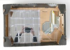 A sectional display case with a reflective back together with Swarovski mirror bases for display