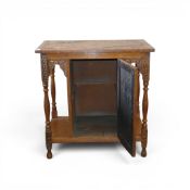 Carved oak hall cabinet with hand-carved central floral motif on the cabinet door, stand on turned