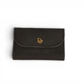 Vintage Christian Dior clutch bag made of black honeycomb canvas featuring a gold tone CD logo on