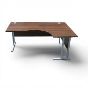 Executive ergonomic corner office desk with walnut-effect laminate finish, supported by double