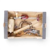 A collection of vintage tools to include saw, manual crank drill, large vintage brass insemination