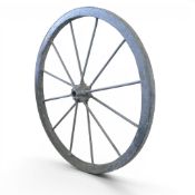 Antique wagon wheel with weathered metal rim and spokes.
